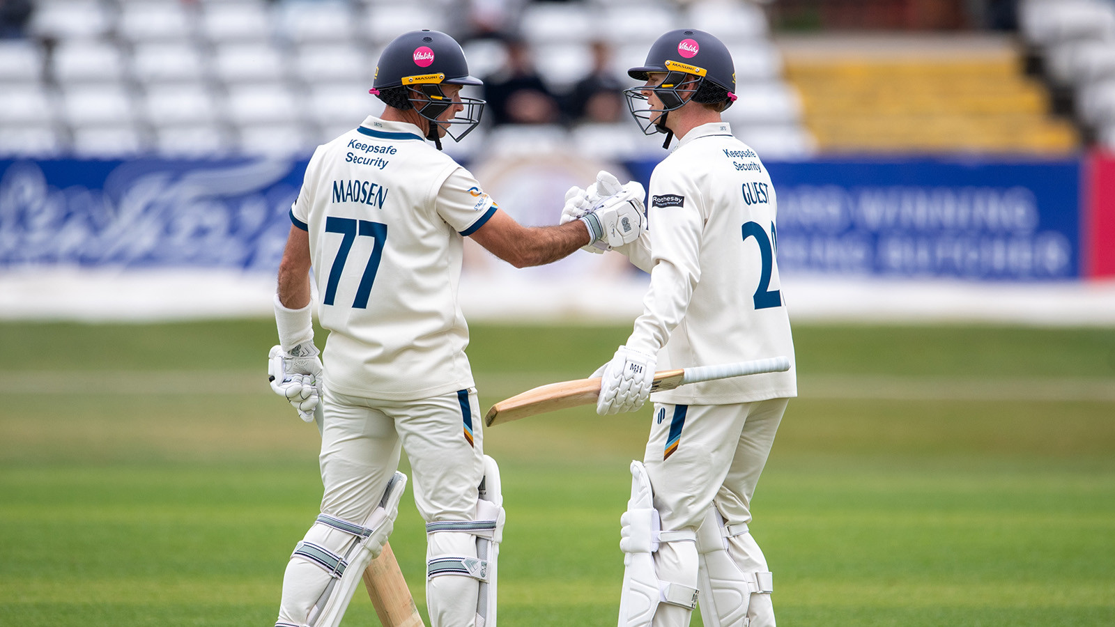 REPORT | Madsen and Guest hit half-centuries on rain interrupted day